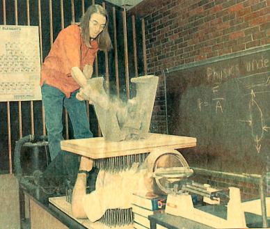 Photo of a student lying on a bed of nails